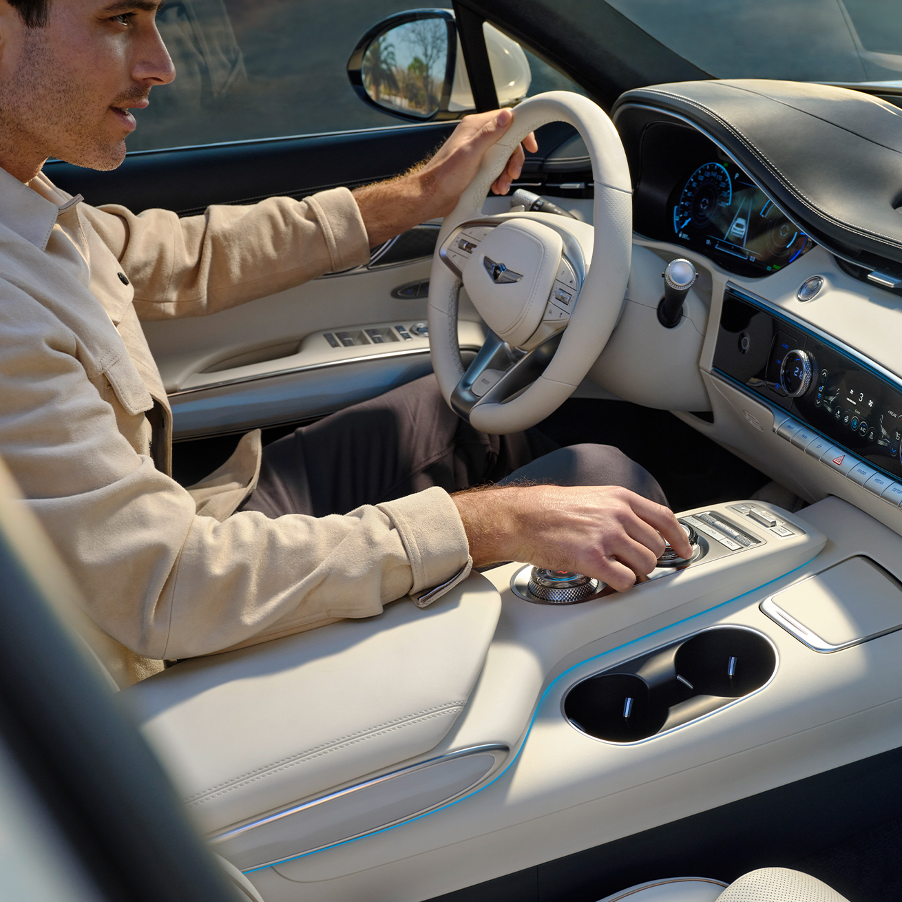 Man in driver's seat of Electrified GV70