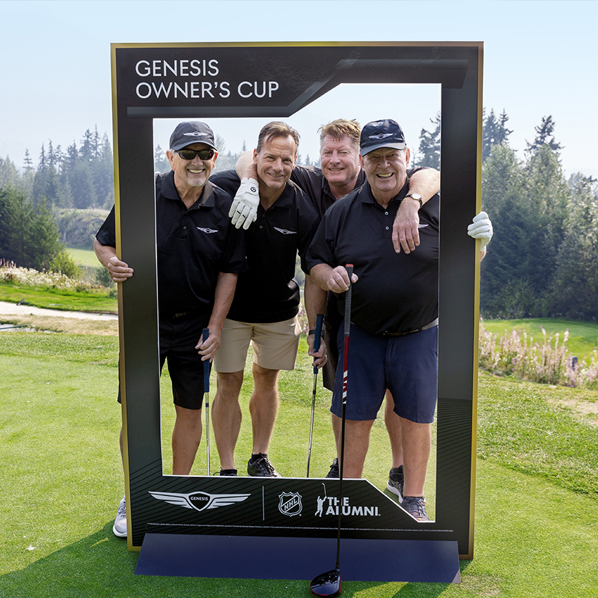 4 golfers posing for an picture on a golf course for the Genesis Owner's Cup
