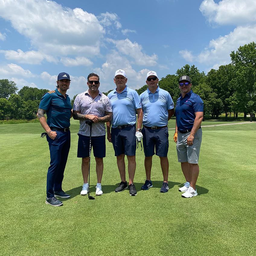 5 men posing for a picture on the golf course in Nashville