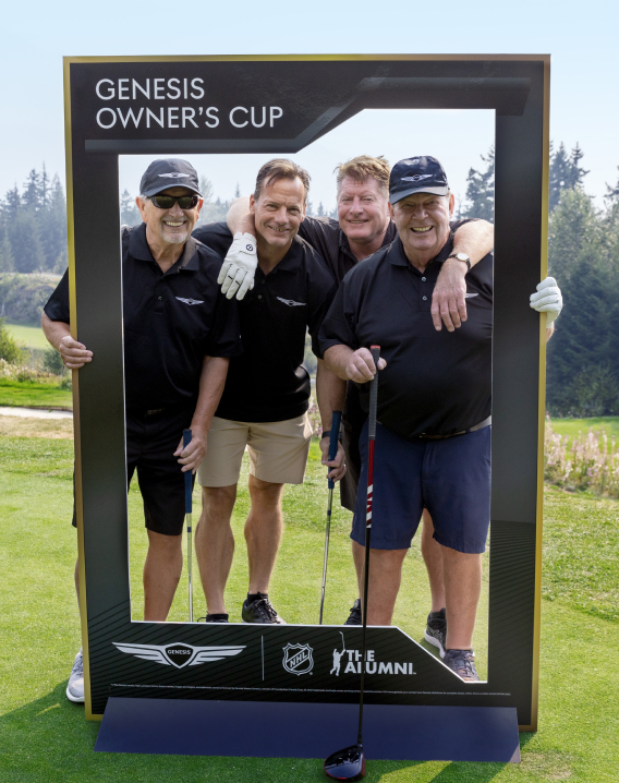4 men on a golf course 
