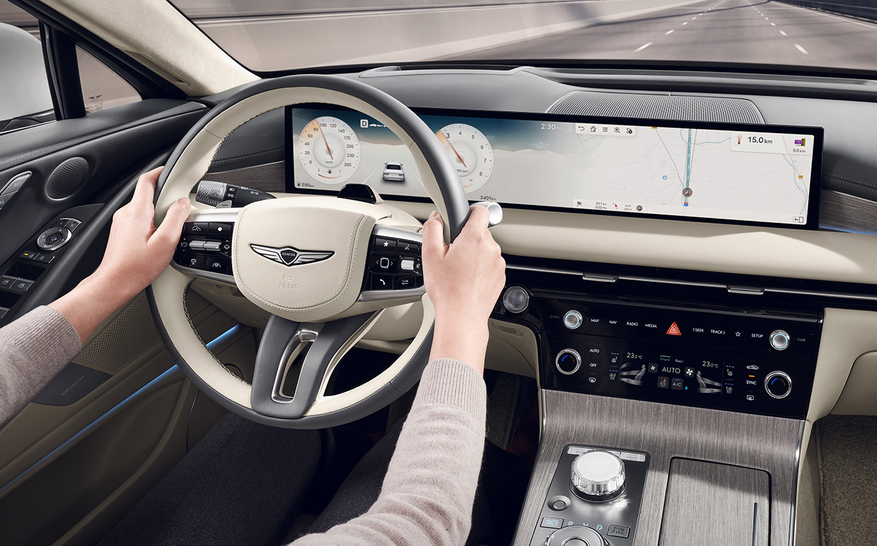 Navigation and highway driving support for the driver are visible on the infotainment display.