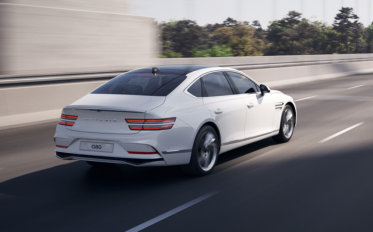 The front end of G80 driving on the highway.