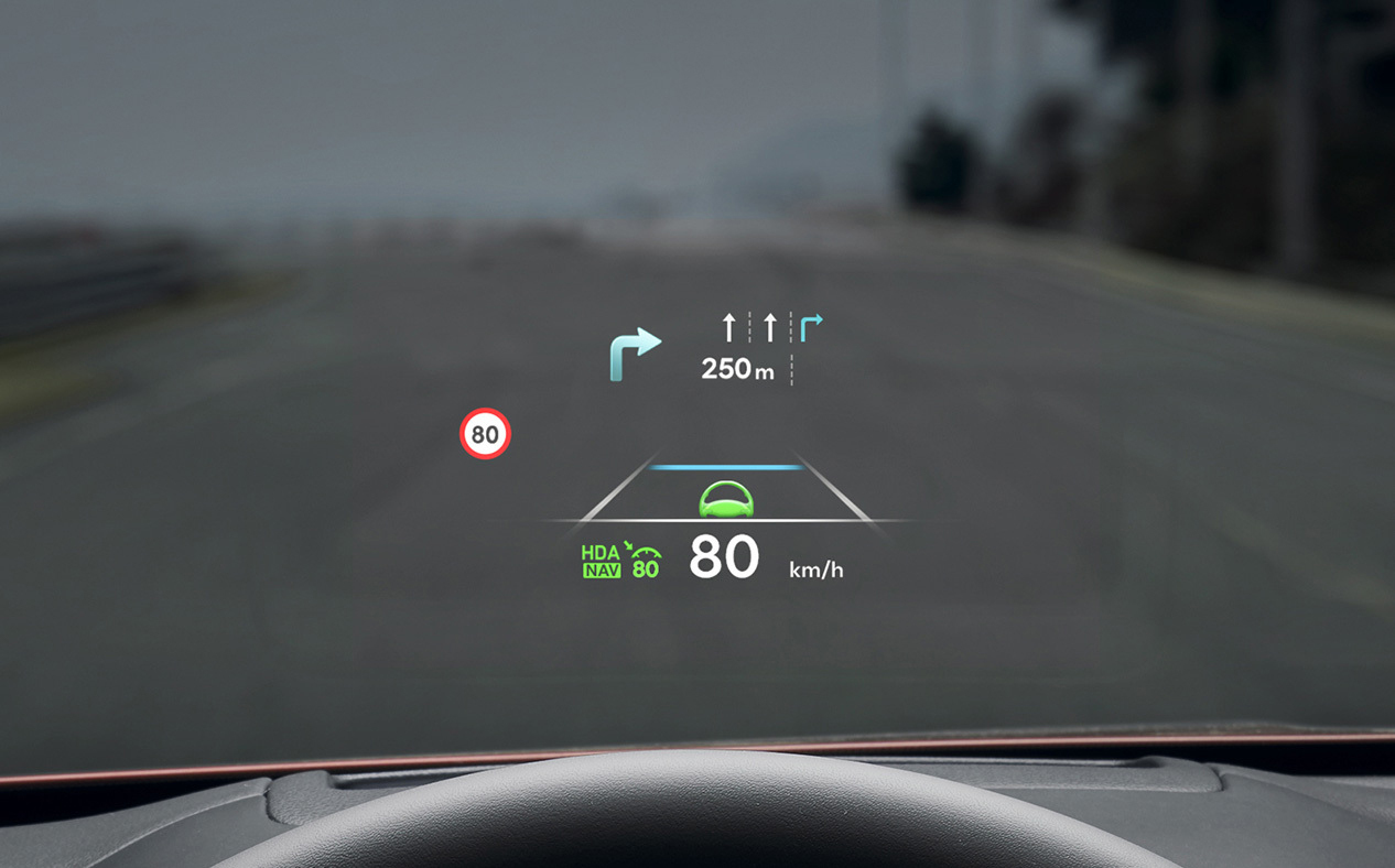 Navigation information is seen on the windshield. 