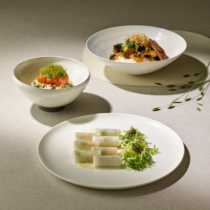 An a la carte menu of Korean food, neatly presented on white plates.