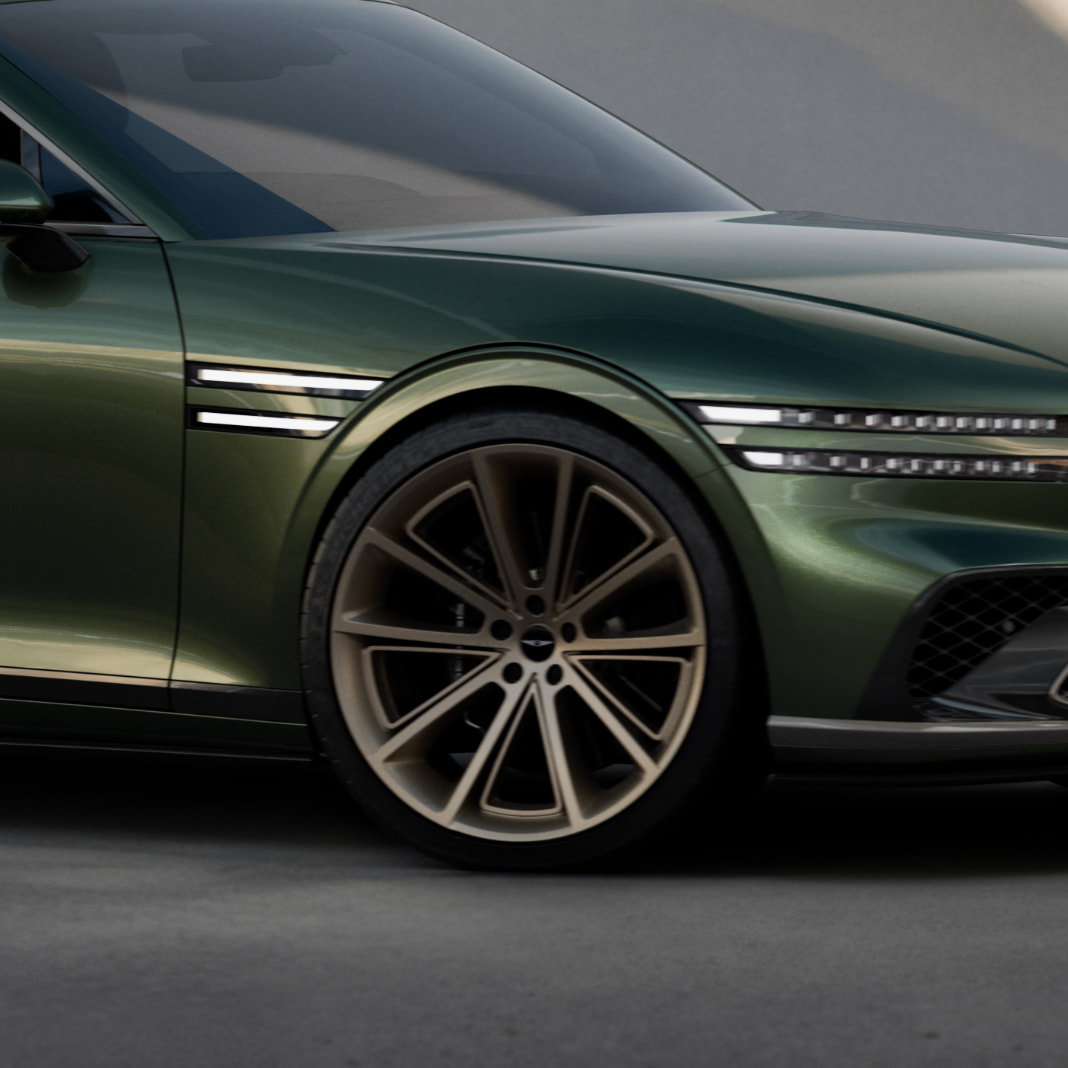 The 5-spoke wheels of the Genesis X Gran Coupe are shown zoomed in.