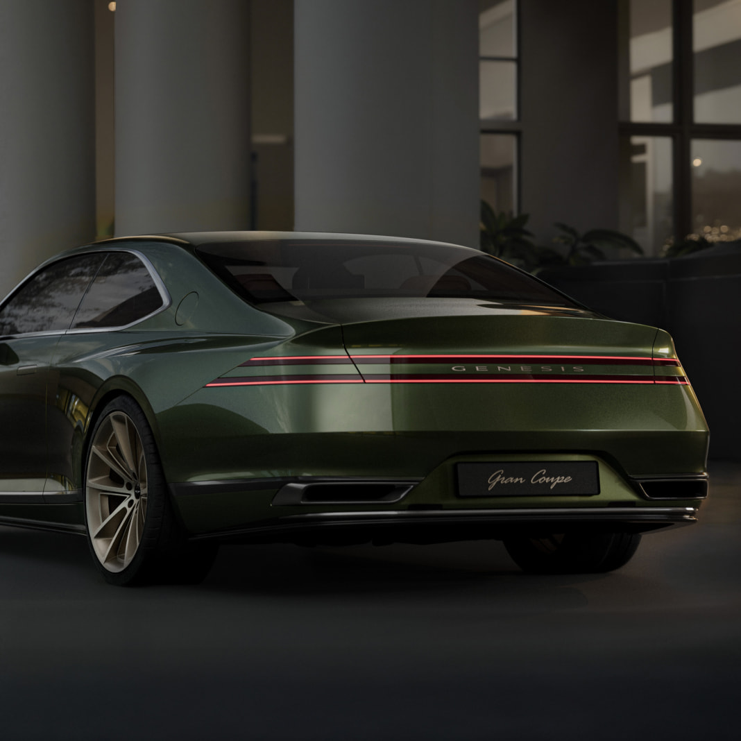 The rear of the Genesis X Gran Coupe is visible. Two lines of lamps stretch out horizontally.