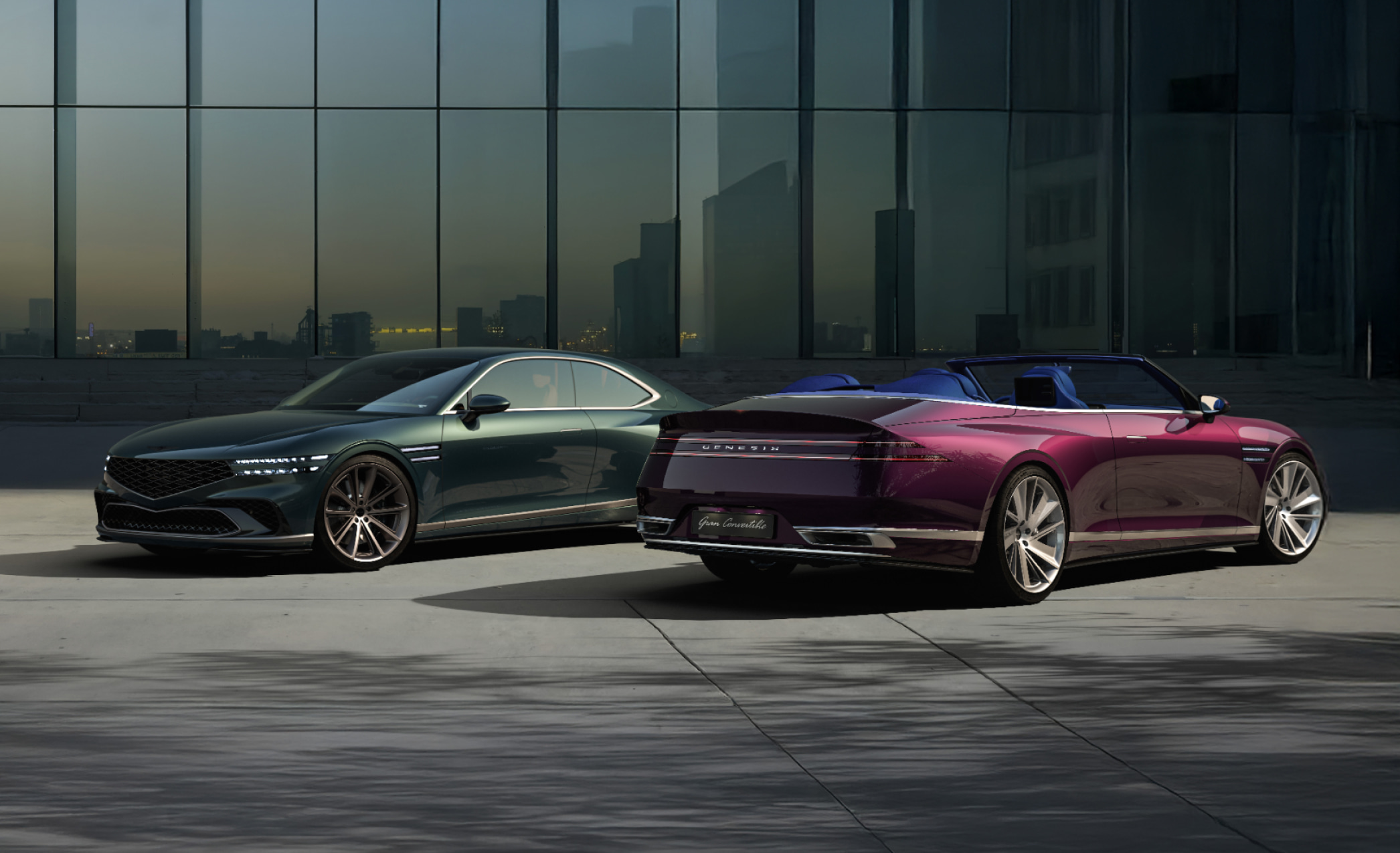 The Genesis X Gran Coupe and Convertible stand side by side in front of a modern city background. The convertible is showing the rear.