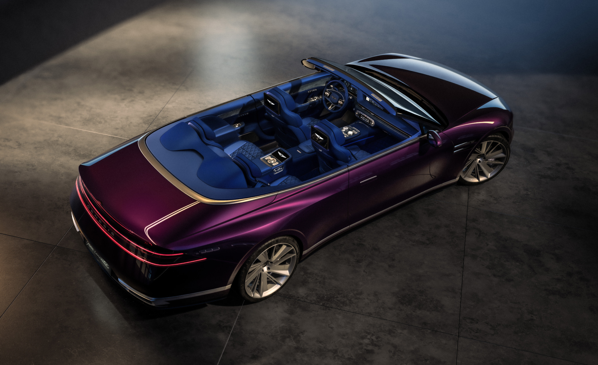 This is an aerial view of the Genesis X Gran Convertible. The interior of the vehicle is visible.
