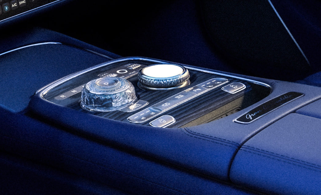 The blue-toned center console appears zoomed in. The Crystal Sphere electronic transmission stands out.
