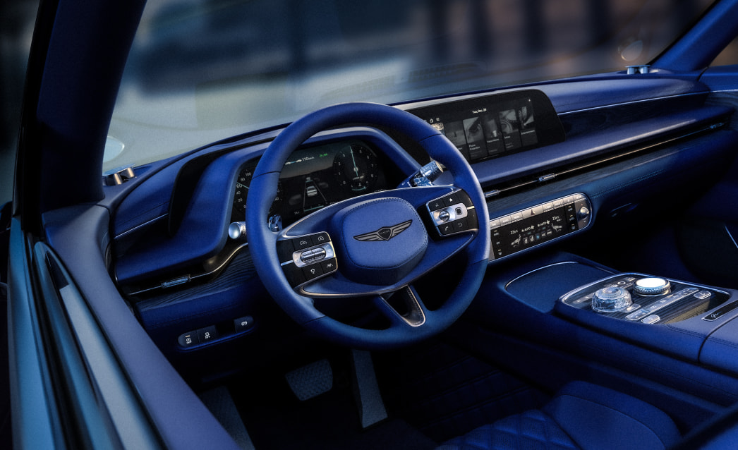 This is a view of the driver's seat from the window with the first row door open. You can see the blackberry colored car interior.
