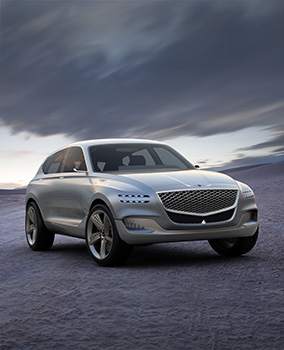 The Genesis GV80 concept car is parked in the middle of the vast wilderness.