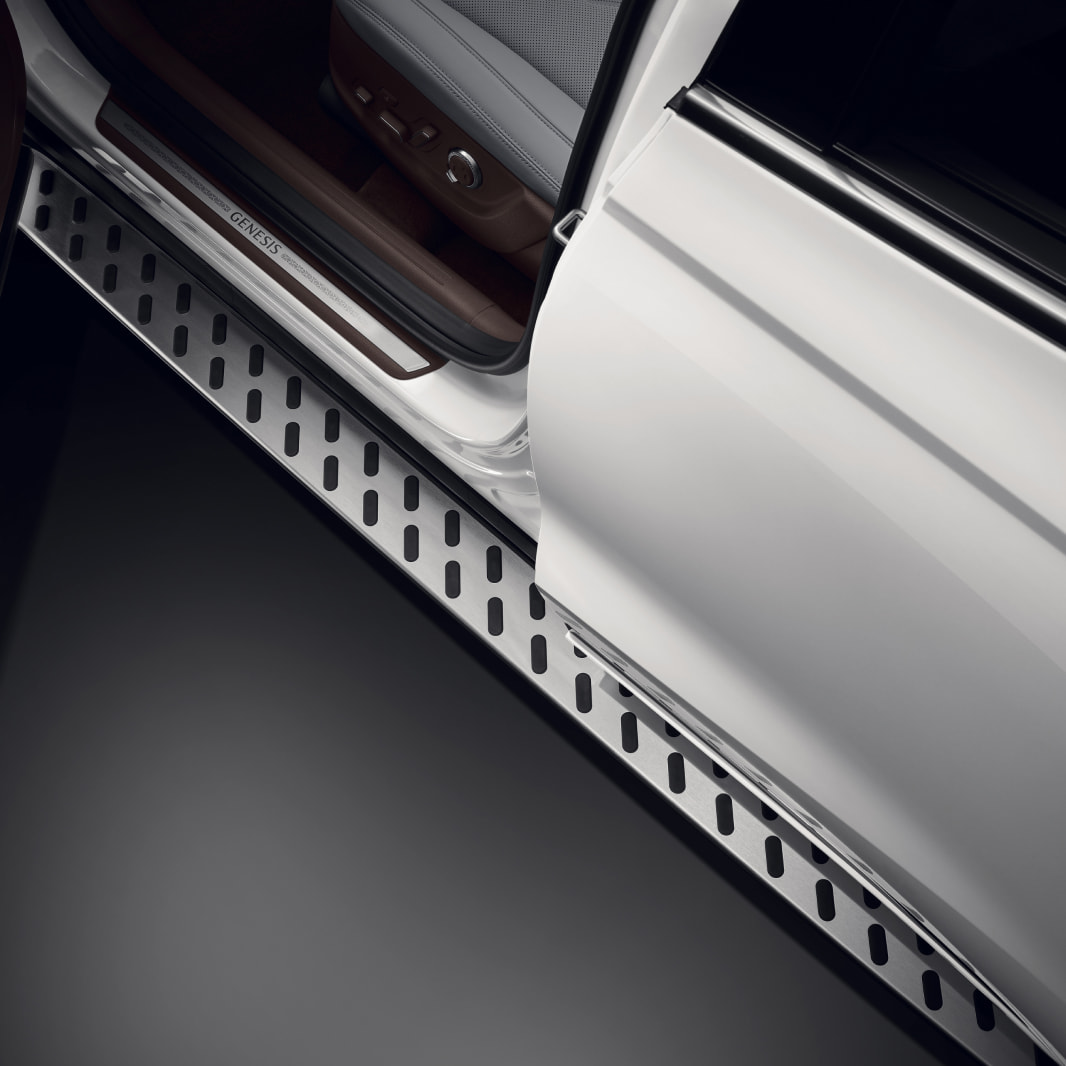 The open car door reveals detailed view of the slip-resistant pattern on the footstep, which assists with vehicle entry.