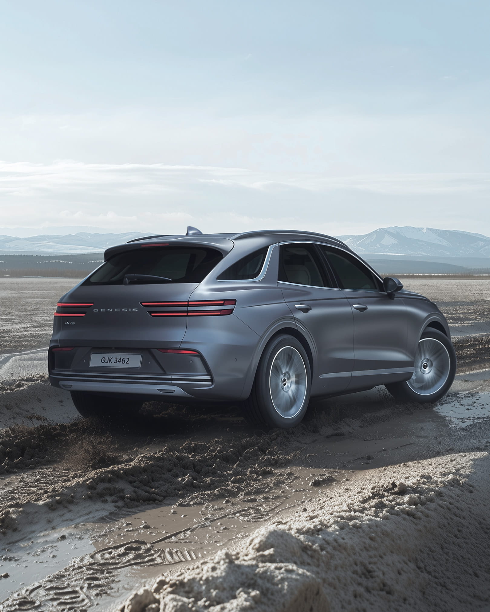 The Electrified GV70 drives on a muddy road.
