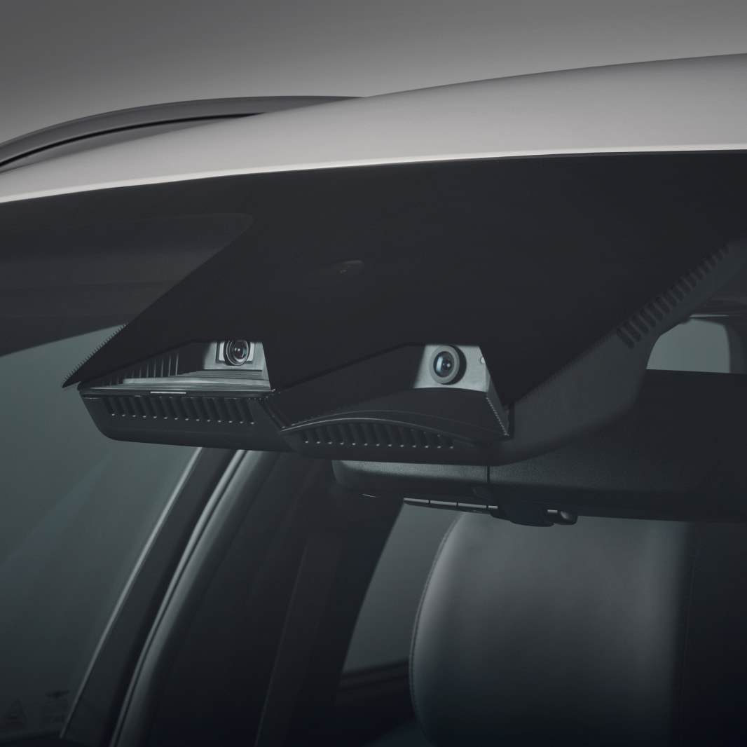 A camera lens inside the vehicle faces the outside.