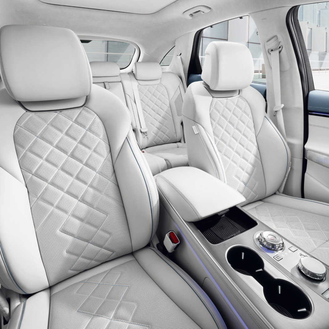 A view of the driver and front passenger seats, both with leather upholstery.
