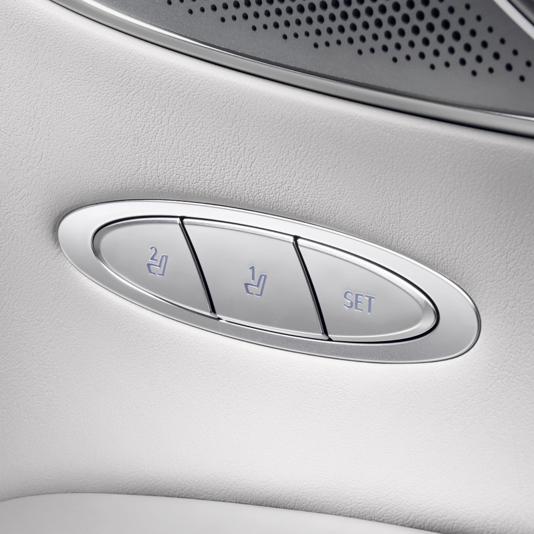 A close-up view of the seat adjustment buttons on the door.