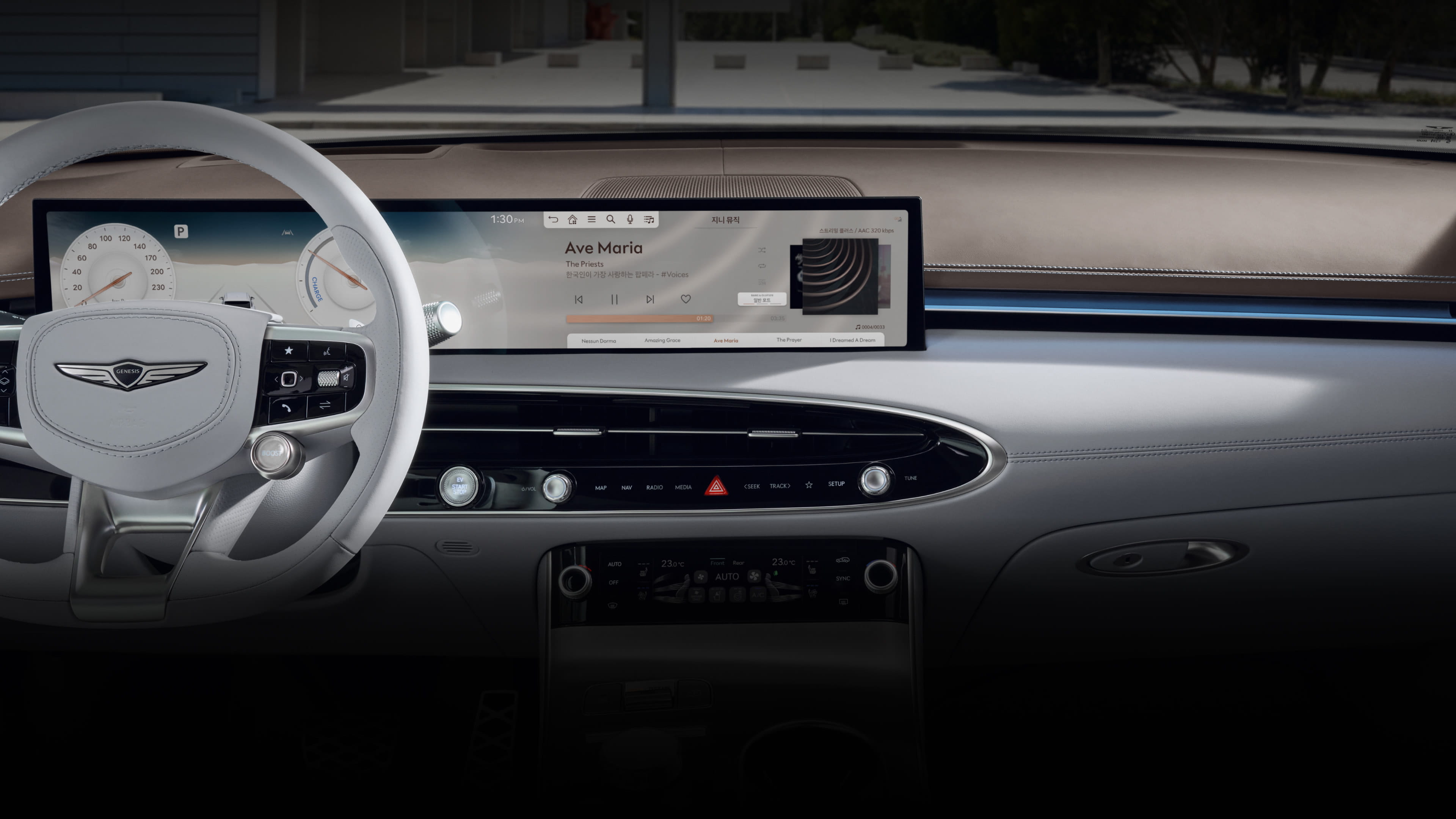 A view of the wide display screen in front of the driver's seat. The screen shows the status window for music playback.