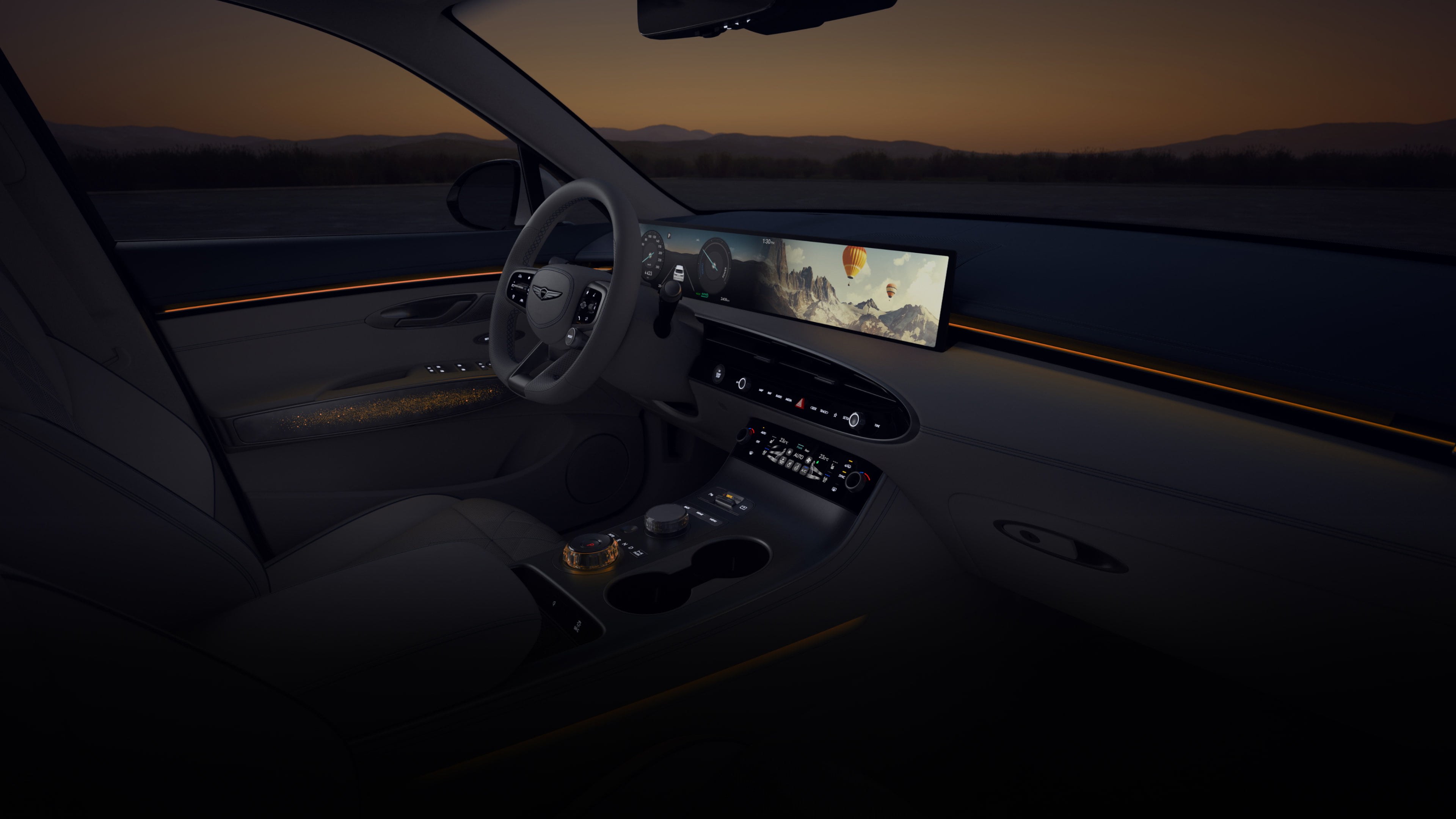 A wide-angle view of the driver's seat from the front passenger's seat. A vibrant array of colorful graphics cycle on the wide display screen in front of the driver’s seat. As the colors on the display shift, so does the ambient lighting of the vehicle's interior. 