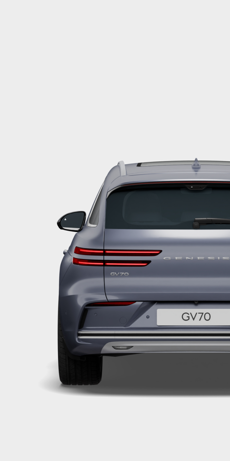 The rear view of the Electrified GV70 in Ceres blue exterior color is visible.
