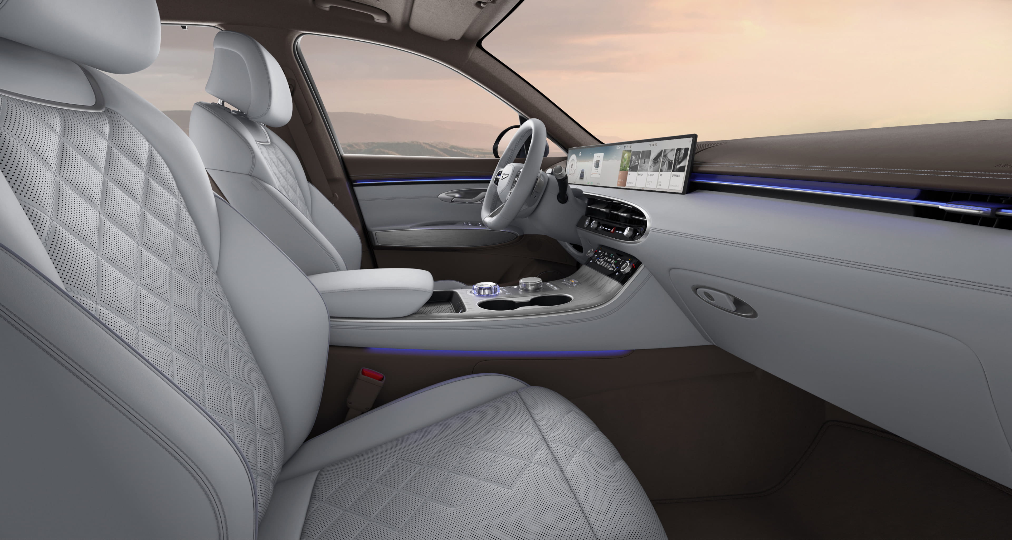 The interior of the Electrified GV70, featuring an Urban Brown/Frozen Gray two-tone color.