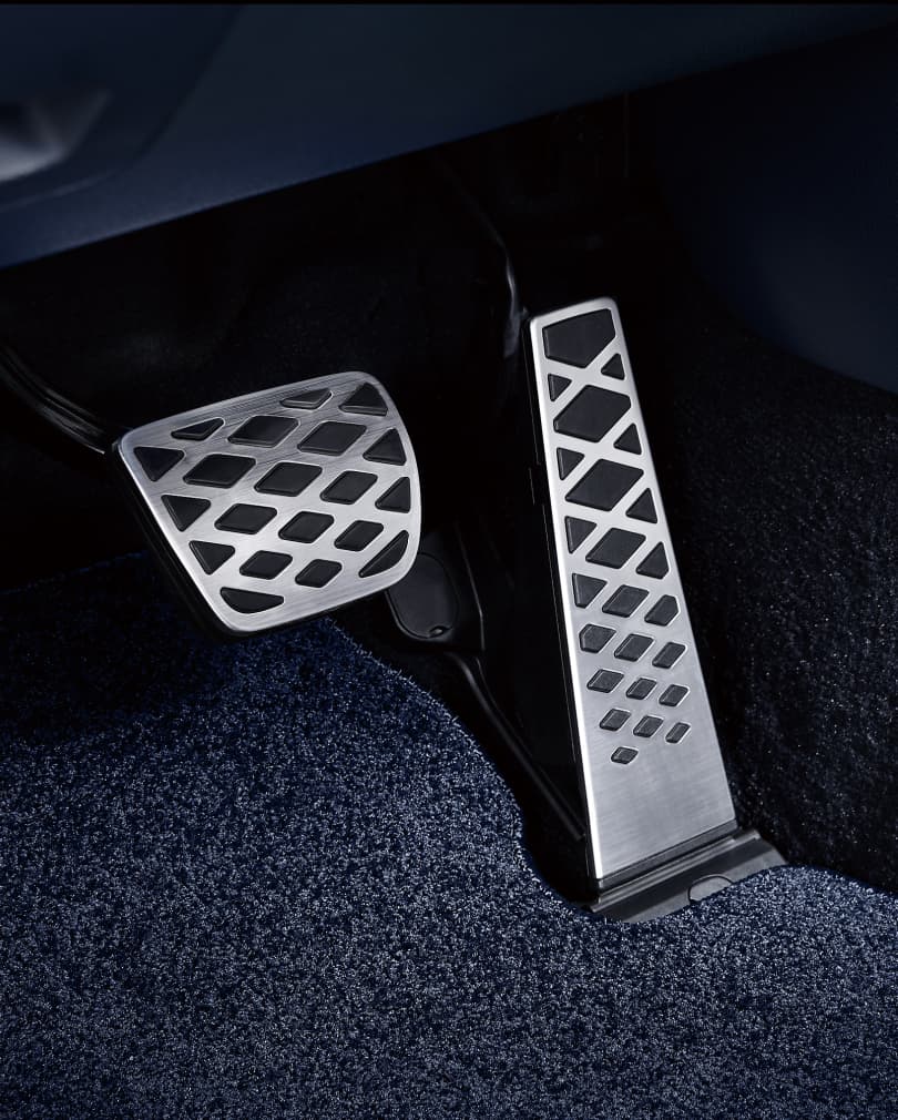 The metal pedal inside the car.