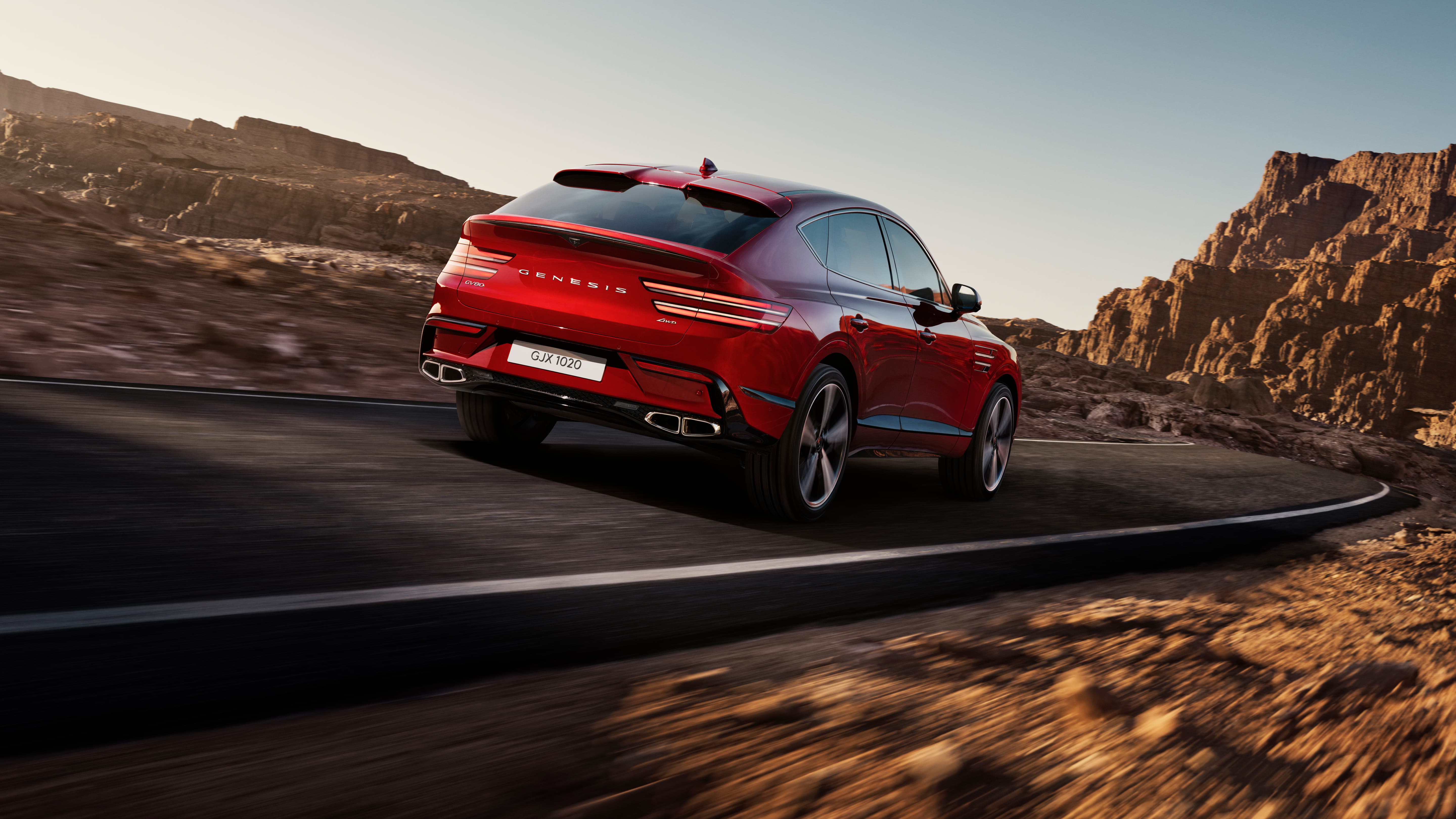 The rear of the Mauna Red GV80 Coupe as it drives.