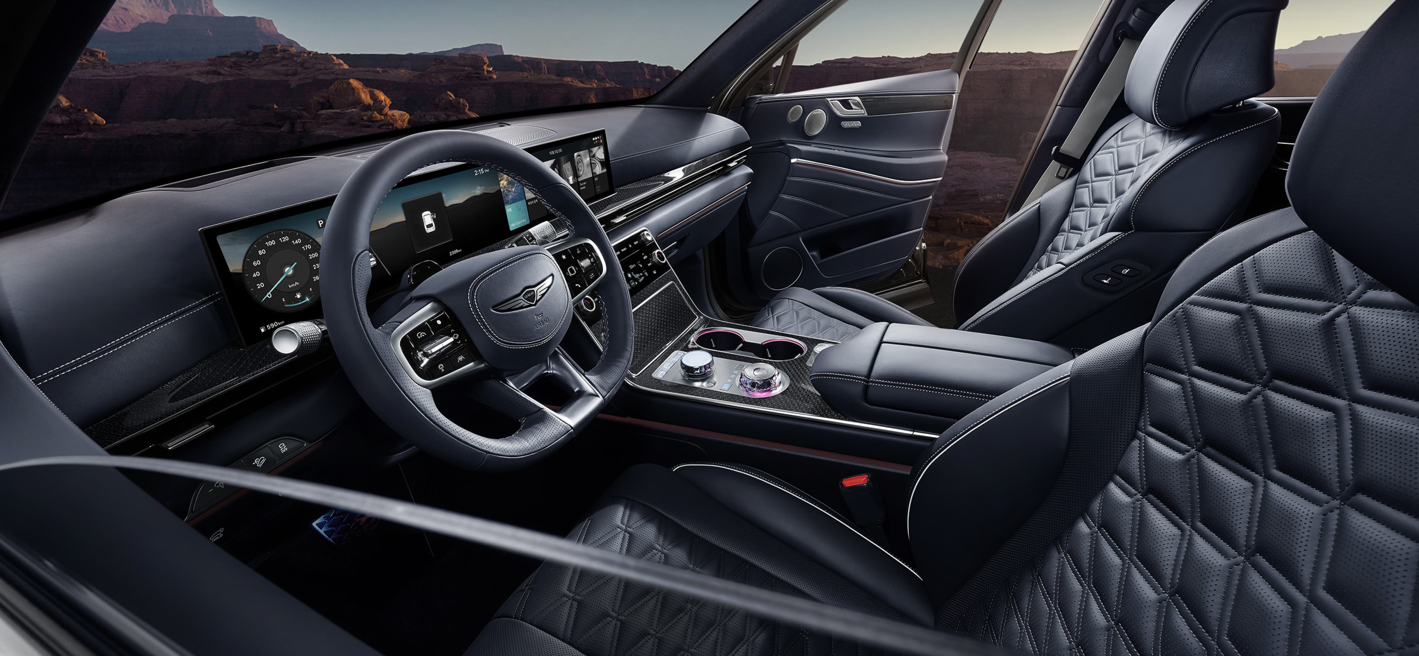 The Ultramarine Blue Mono-tone interior of the GV80 Coupe, shown from the steering wheel to the front seats.