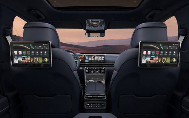 There is a diagonal pattern protection mat on the driver's seat floor, next to the accelerator and brake pedals.