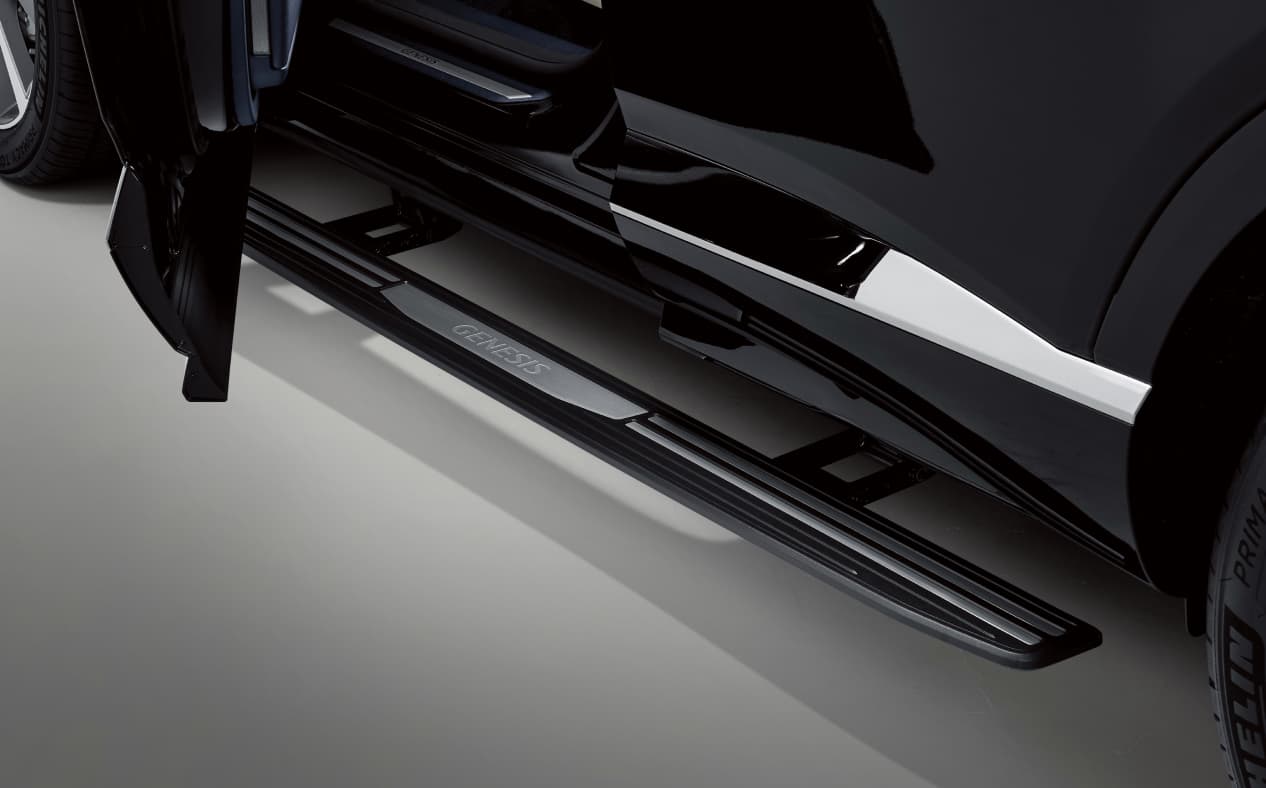 The driver's door of the Vik Black GV80 Coupe is open and has the black power side step installed.