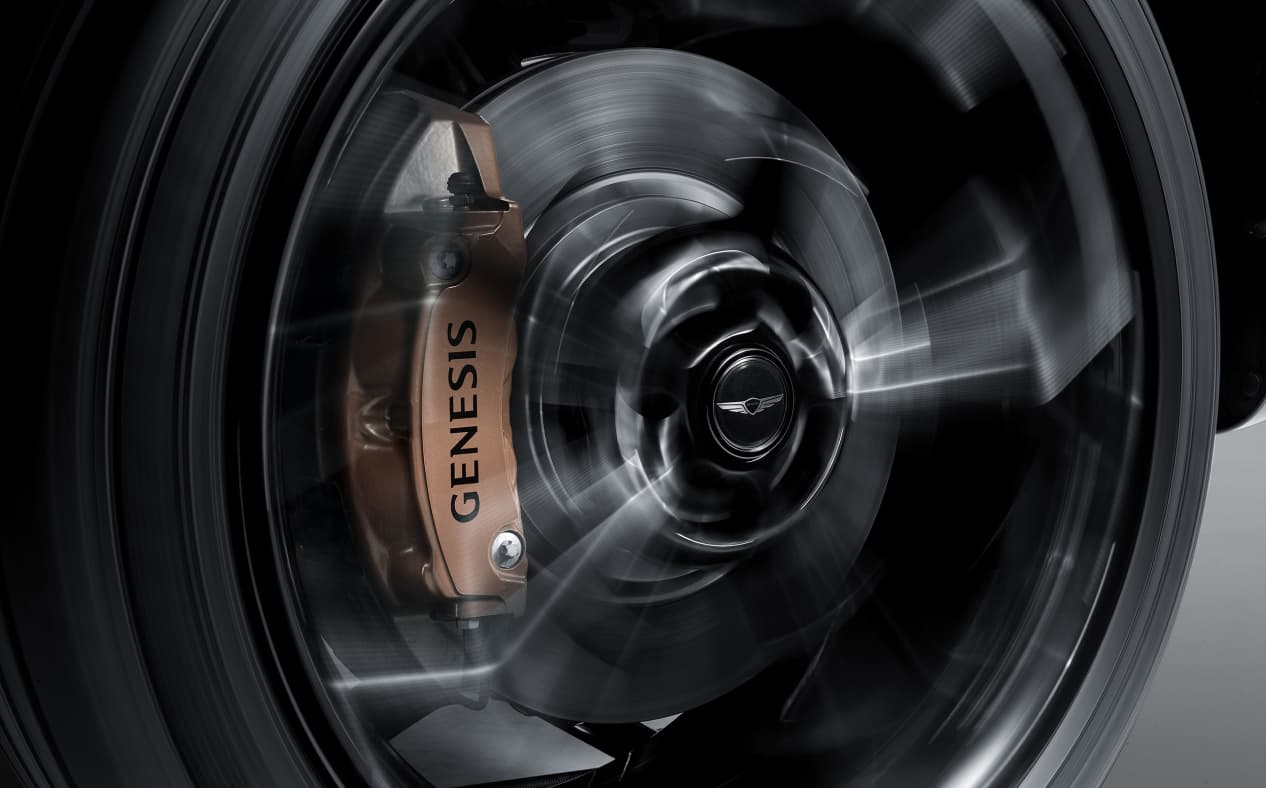 Genesis logo comes to sight on the wheel cap while the wheel is turning.