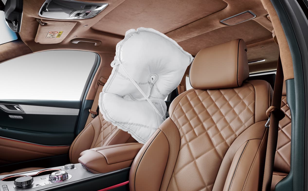 An airbag is seen between the driver's seat and the passenger seat.