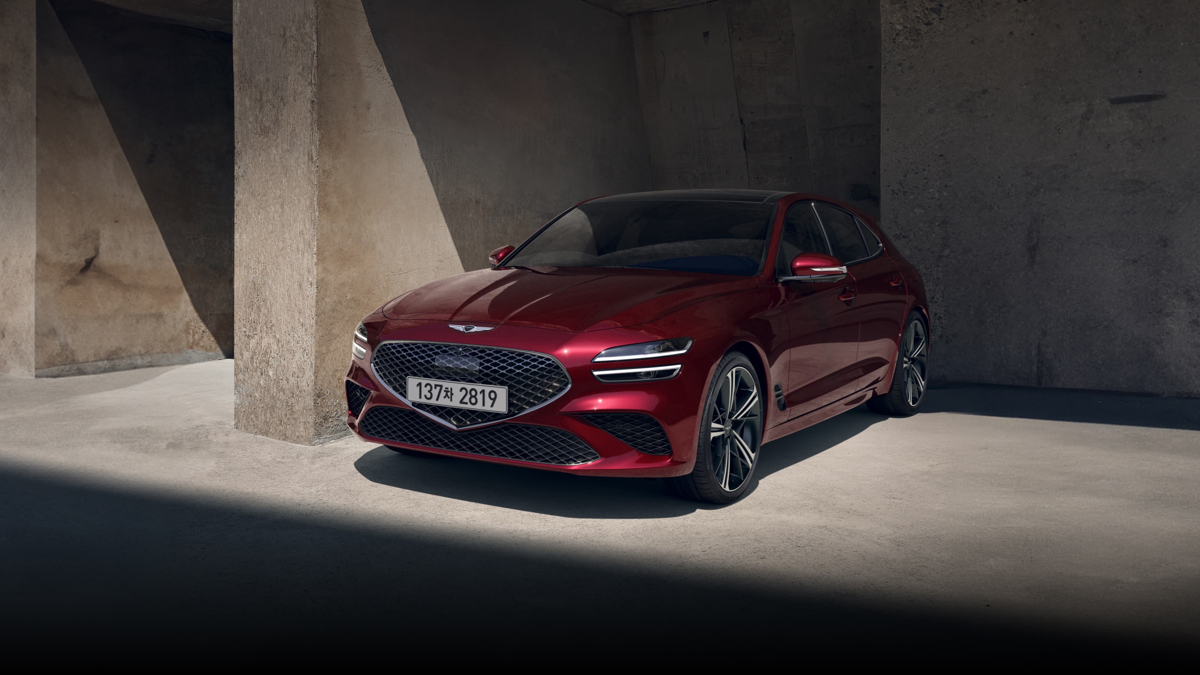 The Savile Silver G70 Shooting Brake driving in the city is followed by a Makalu Gray G70 Shooting Brake, and finally, the front of the Cavendish Red-colored G70 Shooting Brake Sports model.