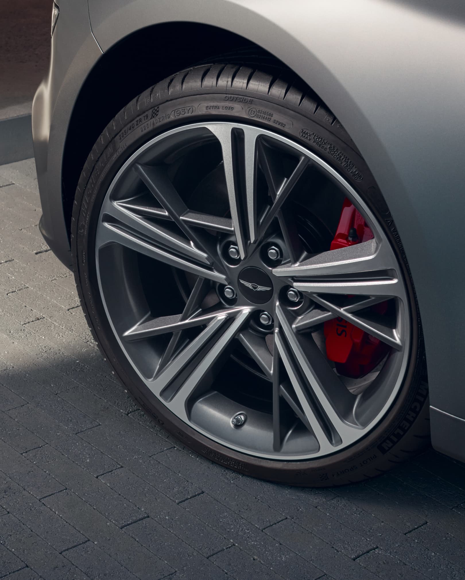 The red Brembo brake calipers on the wheels of the Sports model.