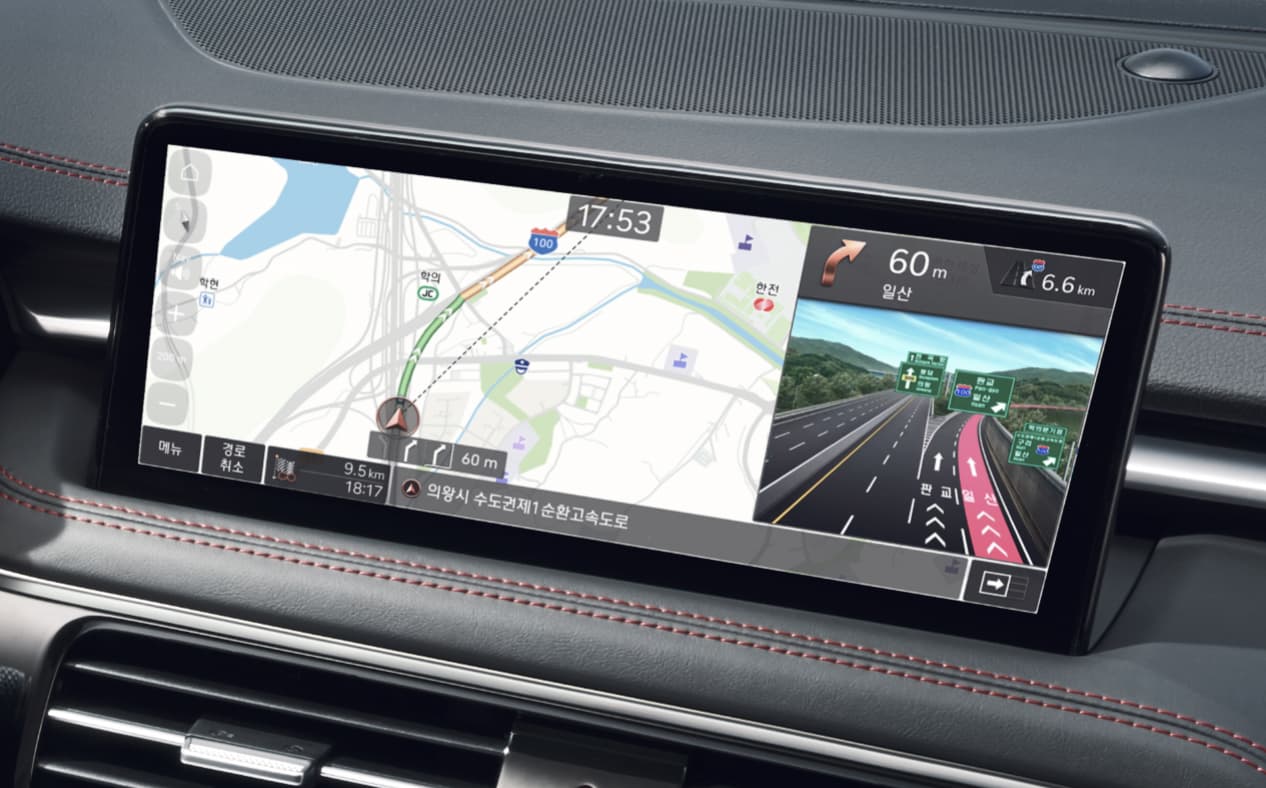 Navigation and highway driving support for the driver are visible on the infotainment display.