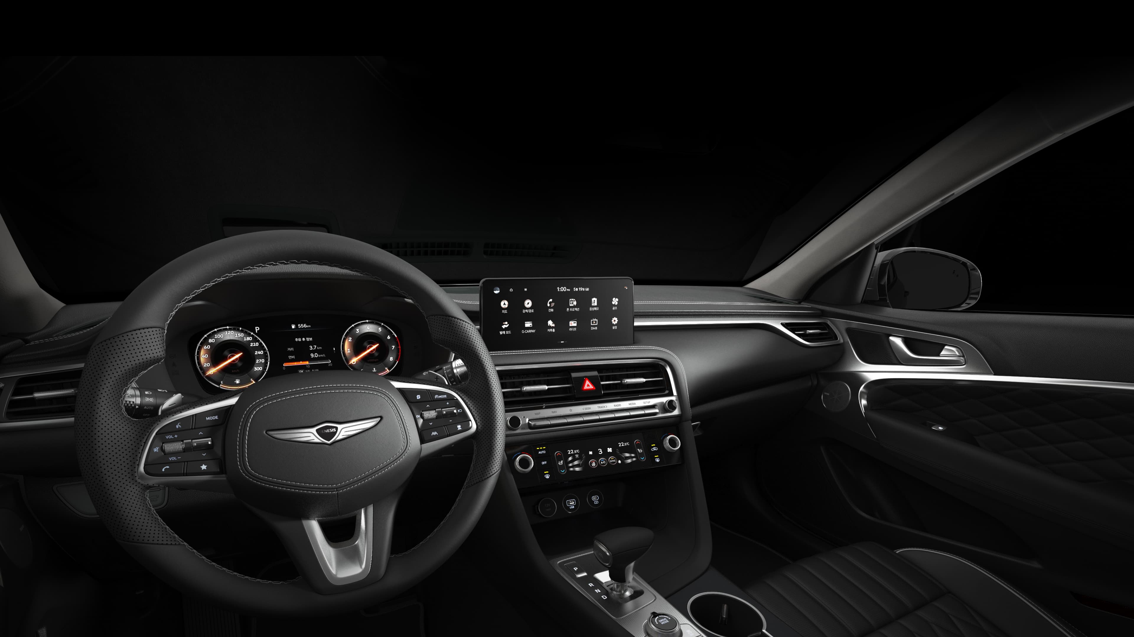 The interior of the G70 Shooting Brake, including the infotainment system, cluster, and air conditioning panel.