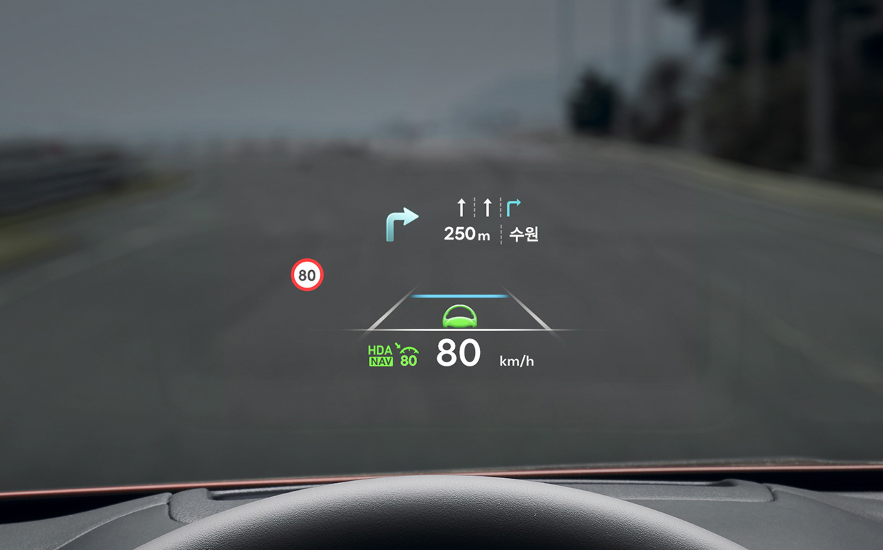 Navigation information is seen on the windshield. 