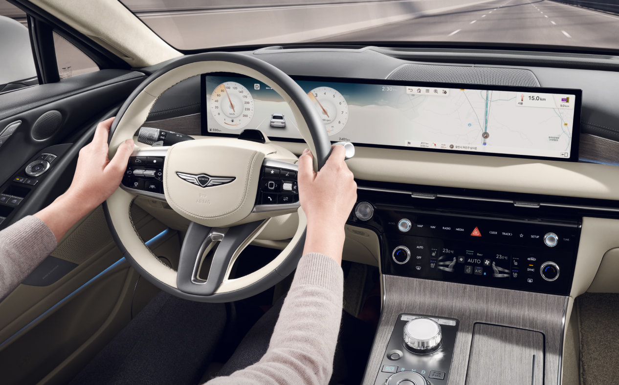 Navigation and highway driving support for the driver are visible on the infotainment display.