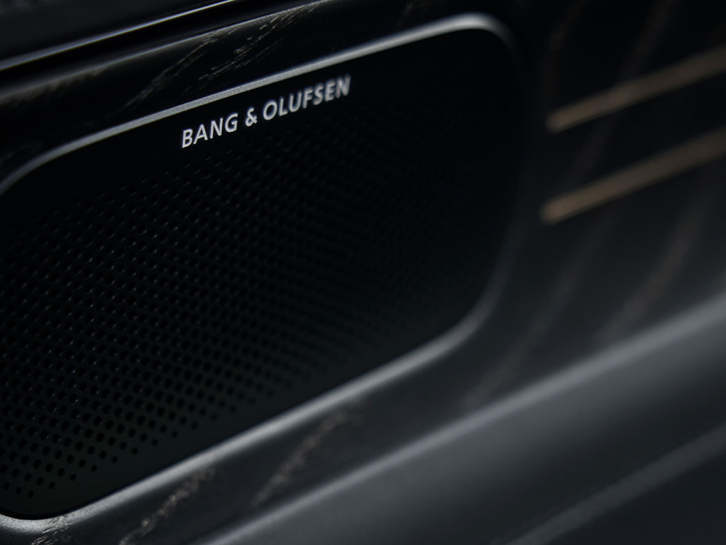 A close-up view of the Bang & Olufsen speaker.