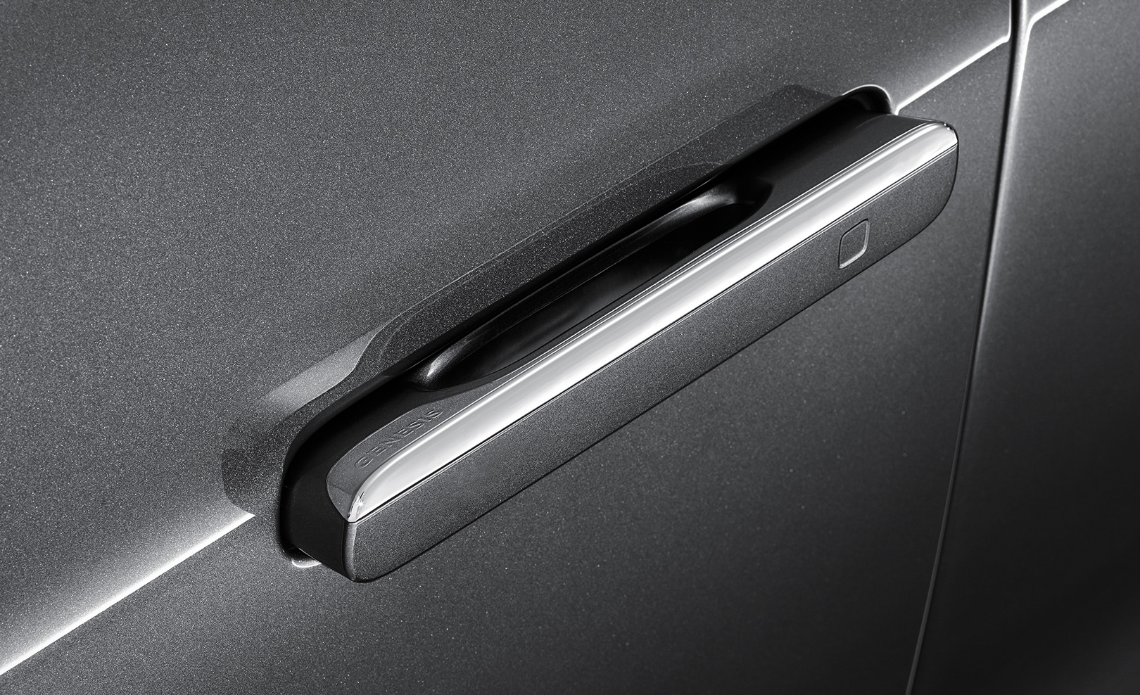 The auto flush door handle sticks out from the door.