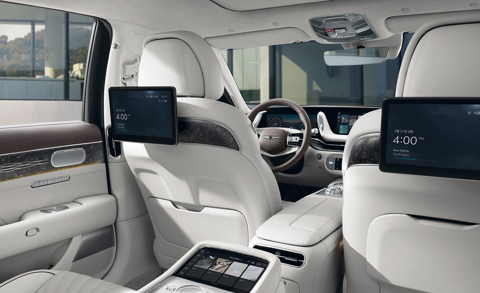 Dual Monitors installed on the back of Glacier White first-row seats.