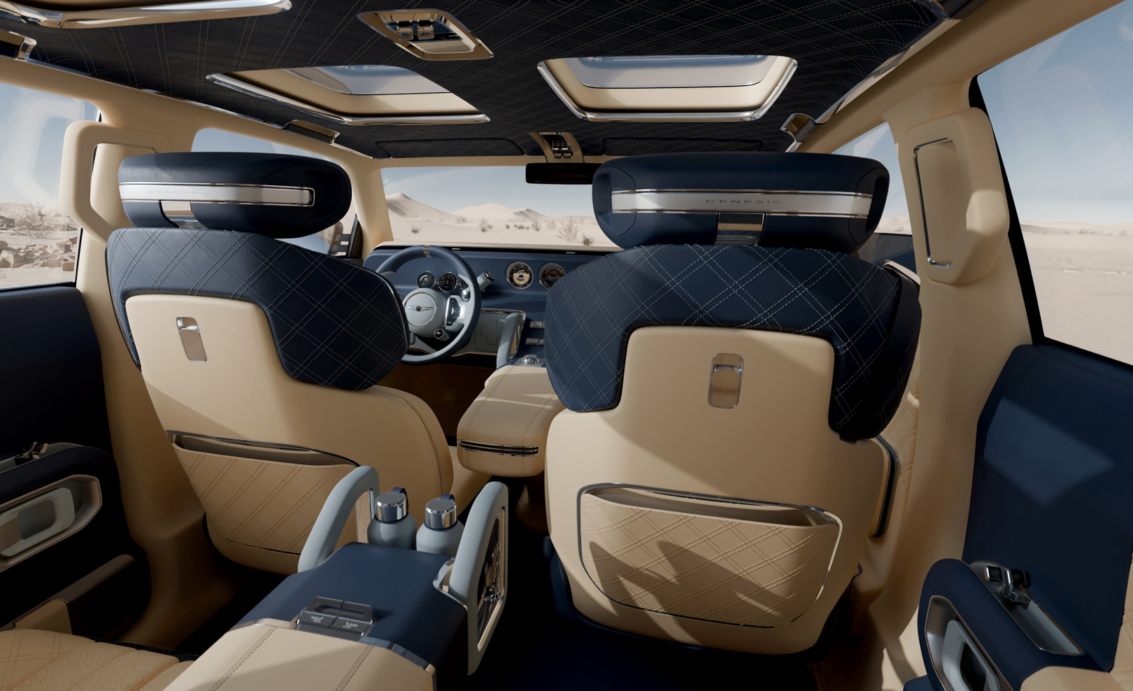 The interior design of the Genesis X Gran Equator is shown from the rear seat looking toward the front row.