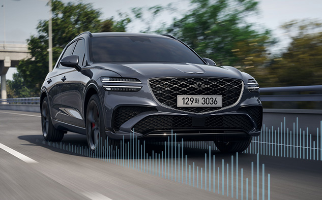 The GV70 is driving on the road.