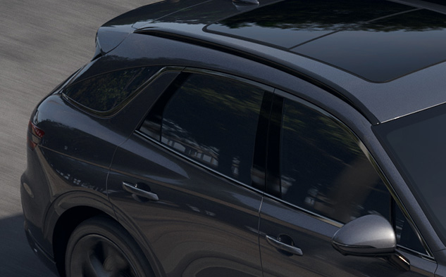 You can see the side window of the GV70 driving on the road.