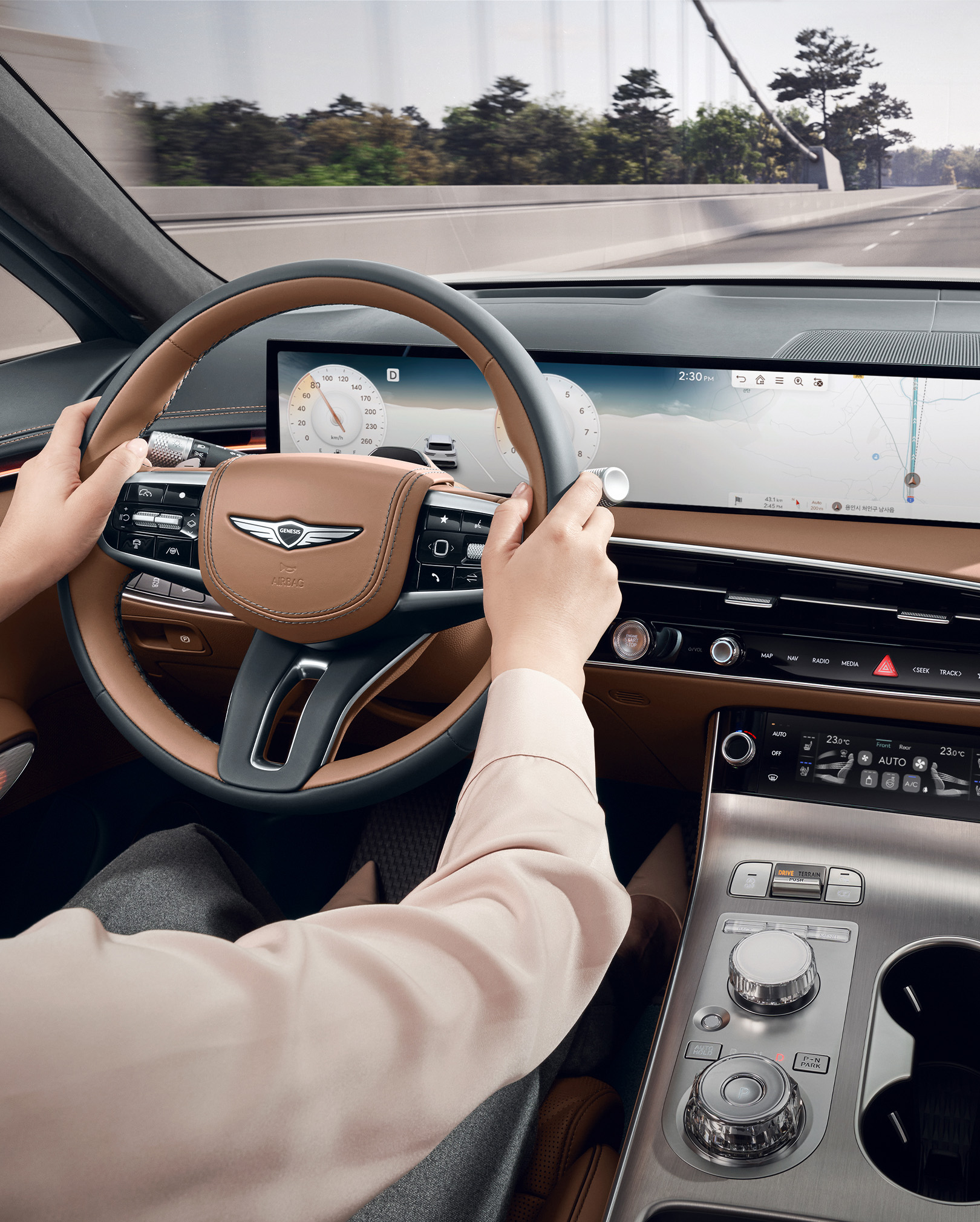 The driver is holding the steering wheel with both hands while driving.