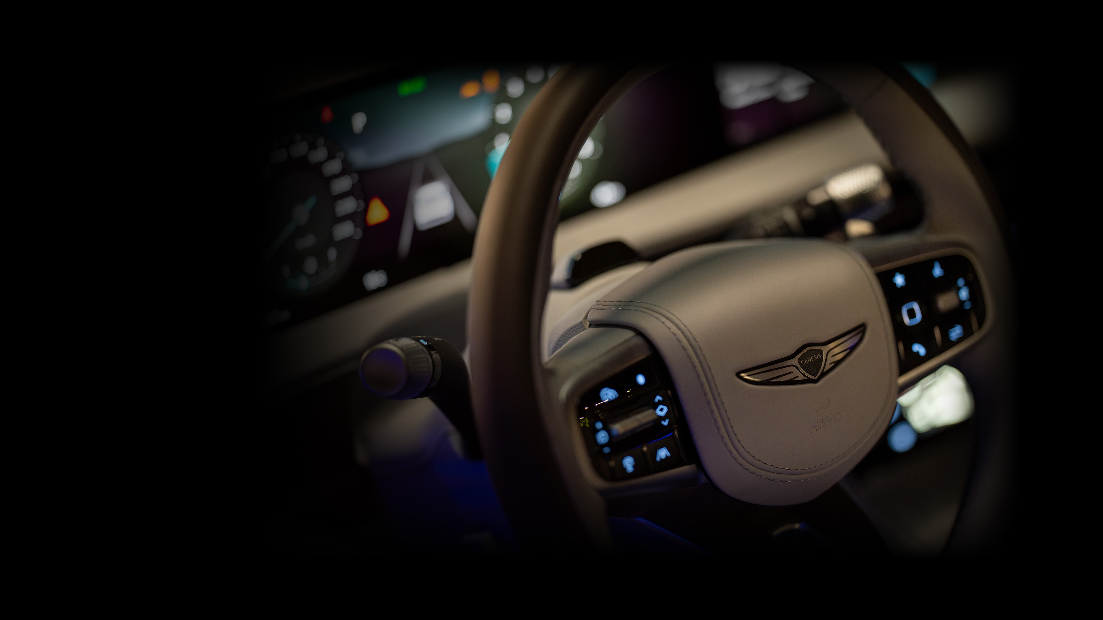 You can see the rear view of the GV70 in Ceres Blue color.
