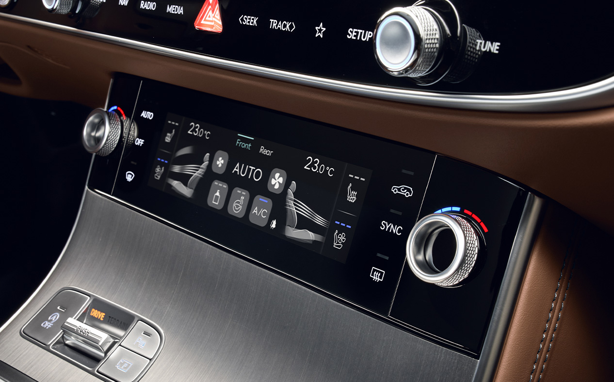 The screen of the control system for adjusting temperature, airflow, and air quality is displayed.