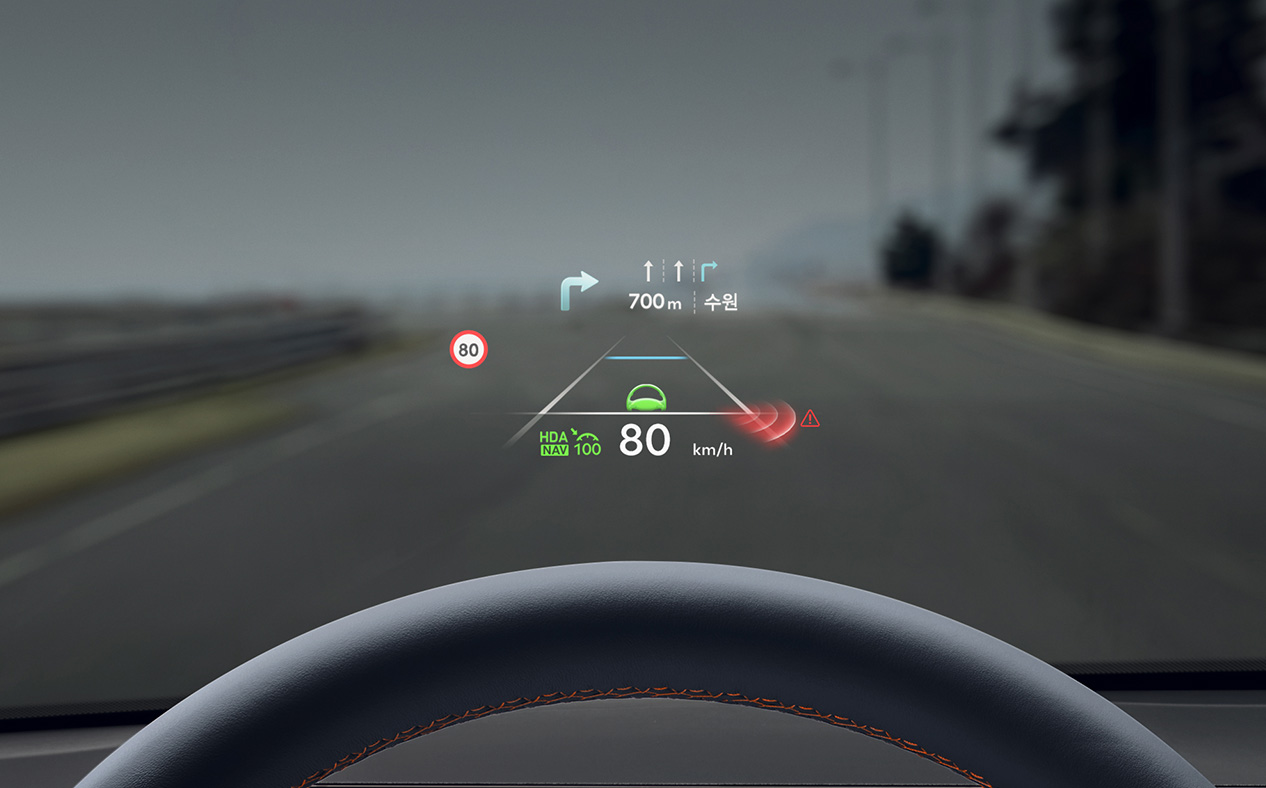 Advanced driver assistance systems are implemented on the windshield in front of the driver's seat. Driving information and sensor detections are displayed.