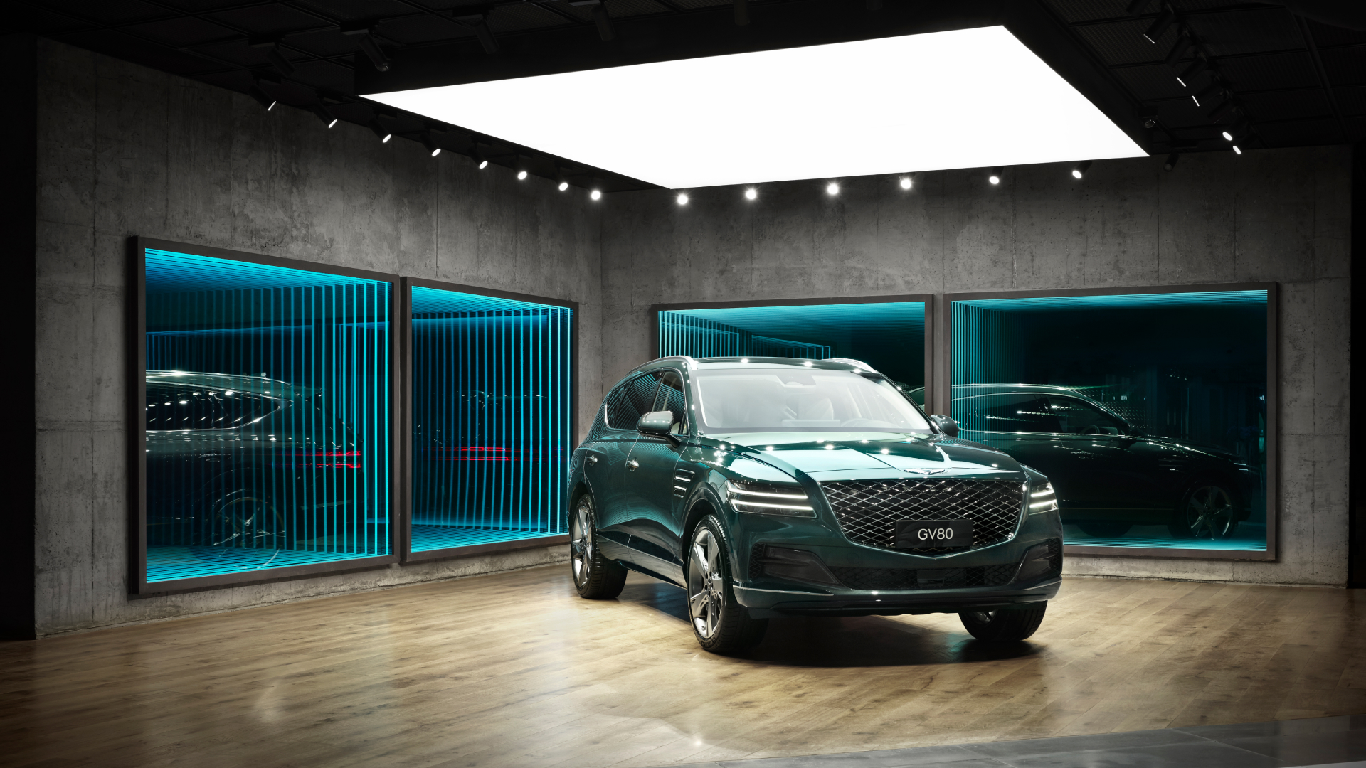 From the outside, Genesis GV80 is seen through glass windows.